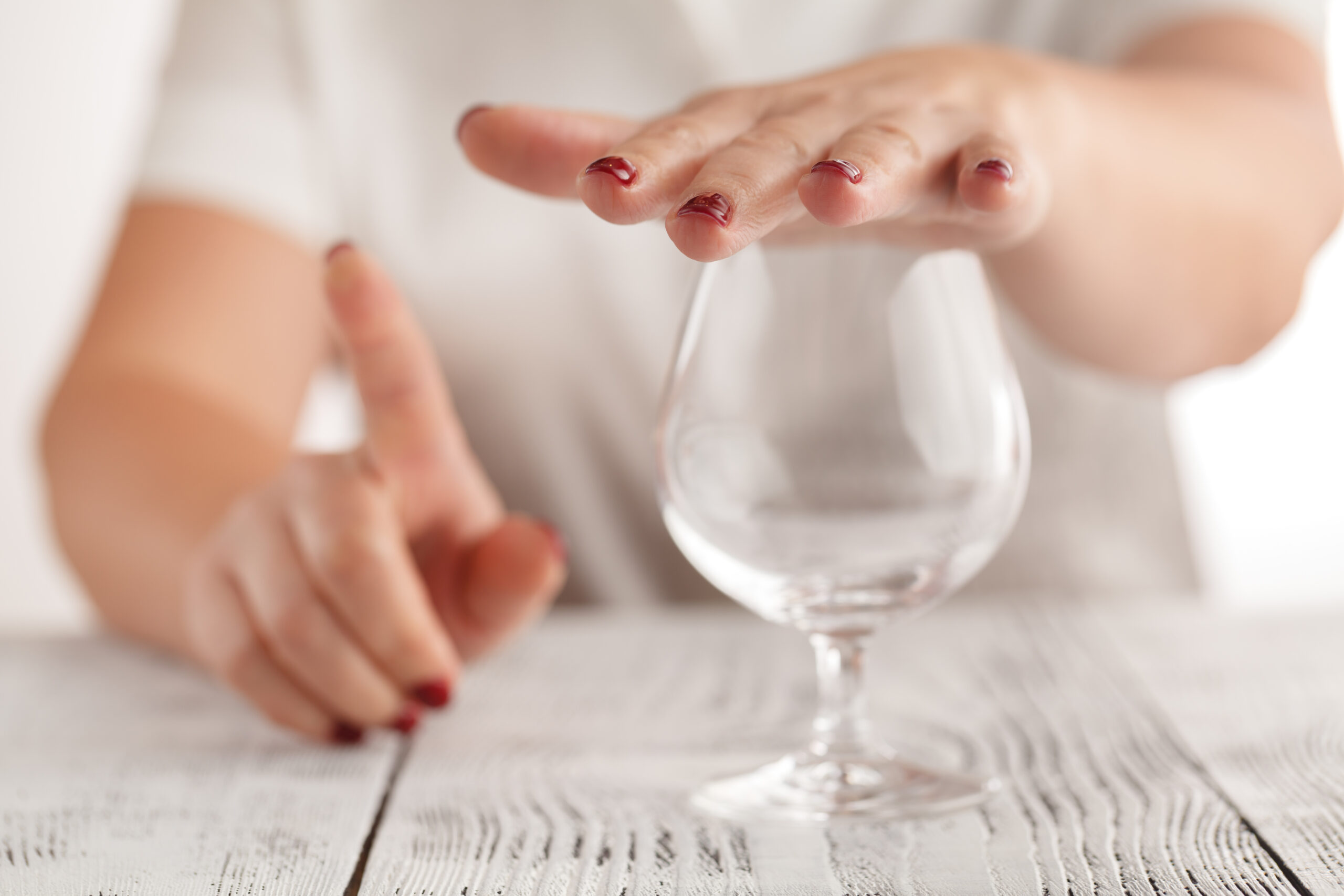 what does a sober companion do - woman covering wine glass concept image.